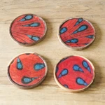 Wood coasters, 'Drops of Boldness' (set of 4) - Set of 4 Drop-Patterned Orange and Red Neem Wood Coasters