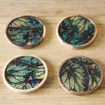 Wood coasters, 'The Nature' (set of 4) - Set of 4 Green Leafy Patterned Round Neem Wood Coasters
