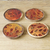 Wood coasters, 'Drops of Elegance' (set of 4) - Set of 4 Drop-Patterned Yellow and Red Neem Wood Coasters