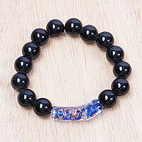 Recycled glass beaded pendant bracelet, 'Blue Okatakyei' - Black and Blue Recycled Glass Beaded Pendant Bracelet