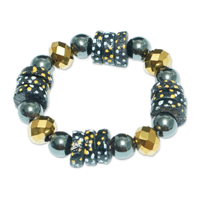 Recycled glass beaded stretch bracelet, 'Leebi Beauty' - Handcrafted Golden and Black Recycled Glass Beaded Bracelet