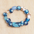 Recycled glass beaded stretch bracelet, 'Dreams & Love' - Eco-Friendly Blue and White Glass Beaded Stretch Bracelet