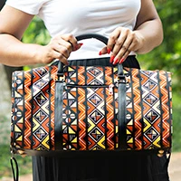 Leather-accented cotton duffel bag, 'African Legacy' - Folk Art-Patterned Leather-Accented Cotton Duffel Bag