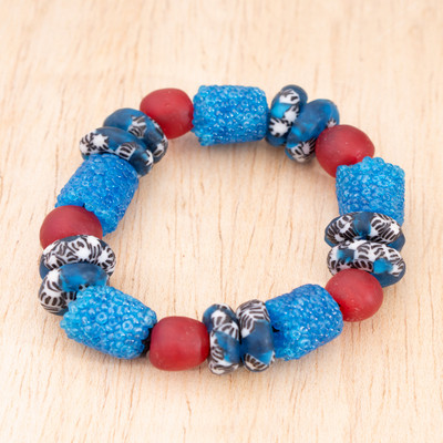 Recycled glass beaded stretch bracelet, 'Ocean Virtue' - Artisan-Made Blue and Red Recycled Glass Beaded Bracelet