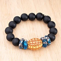 Recycled glass beaded stretch pendant bracelet, 'Blessed Bloom' - Folk Art-Inspired Black and Brown Recycled Glass Bracelet