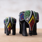 Wood and recycled glass beaded figurines, 'Elephant Mother and Calf' (pair) - Pair of Hand-Beaded Elephant Mother and Calf Wood Figurines