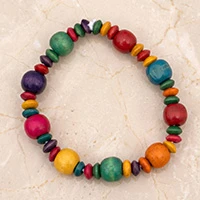 Wood beaded stretch bracelet, 'Dreamy Colors' - Whimsical Sese Wood Beaded Bracelet in a Rainbow Palette
