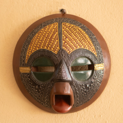 Brass and aluminum embossed African wood wall mask, 'Round Fusion' - African Wood Wall Mask with Embossed Brass Aluminum Motifs