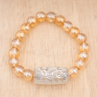 Recycled glass beaded stretch pendant bracelet, 'Graceful Gleams' - Pale Orange and Silver Recycled Glass Bead Stretch Bracelet