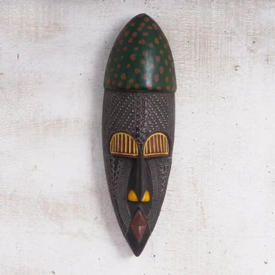 African wood wall mask, 'Dusu Shield' - Elongated Painted African Wood Wall Mask with Brass Details
