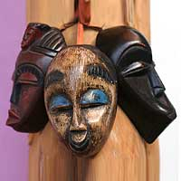 Wood ornaments, 'Be Happy' (set of 3) - African Mask Christmas Ornaments (Set of 3)