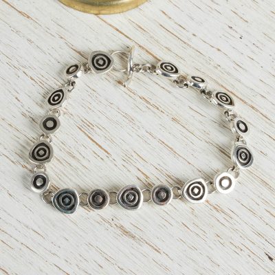Sterling silver charm bracelet, 'Hypnotize' - Handmade Sterling Silver Link Bracelet