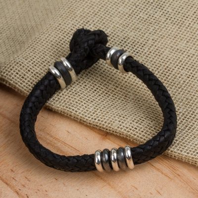 Men's leather braided bracelet, 'Intrepid by Nature' - Men's Black Leather Braided Bracelet with Sterling Silver