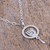 Halskette mit Anhänger aus Sterlingsilber, „Haloed Dove“ – Halskette mit kreisförmigem Taubenanhänger aus Sterlingsilber aus Mexiko