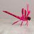 Alebrije-Skulptur aus Holz - Handgefertigte Libellenskulptur aus rosa Copalholz aus Mexiko