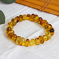 Amber beaded stretch bracelet, 'Honey Stones' - Hand Crafted Amber Bead Stretch Bracelet from Mexico
