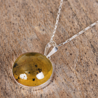 Amber pendant necklace, 'Honey Planet' - Circular Amber and Silver Pendant Necklace from Mexico