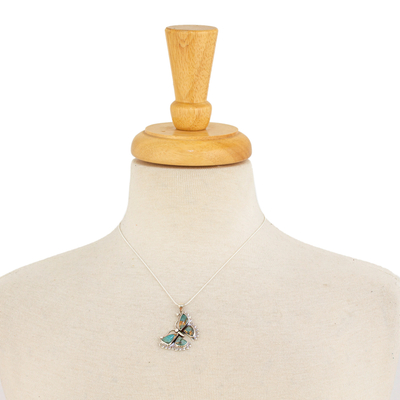 Sterling silver pendant necklace, 'Happiness Soars' - Composite Turquoise and Sterling Silver Butterfly Necklace