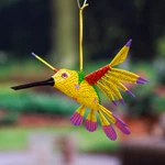 Wood alebrije ornament, 'Fanciful Flutter in Yellow' - Copal Wood Yellow Colorful Alebrije Hummingbird Ornament
