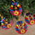 Tin ornaments, 'Candlelit Wreaths' (set of 4) - Hammered Tin Wreath Ornaments from Mexico (Set of 4)