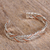 Manschettenarmband aus Sterlingsilber und Kupfer - Taxco-Sterlingsilber-Manschettenarmband mit Zopfmotiv aus Mexiko