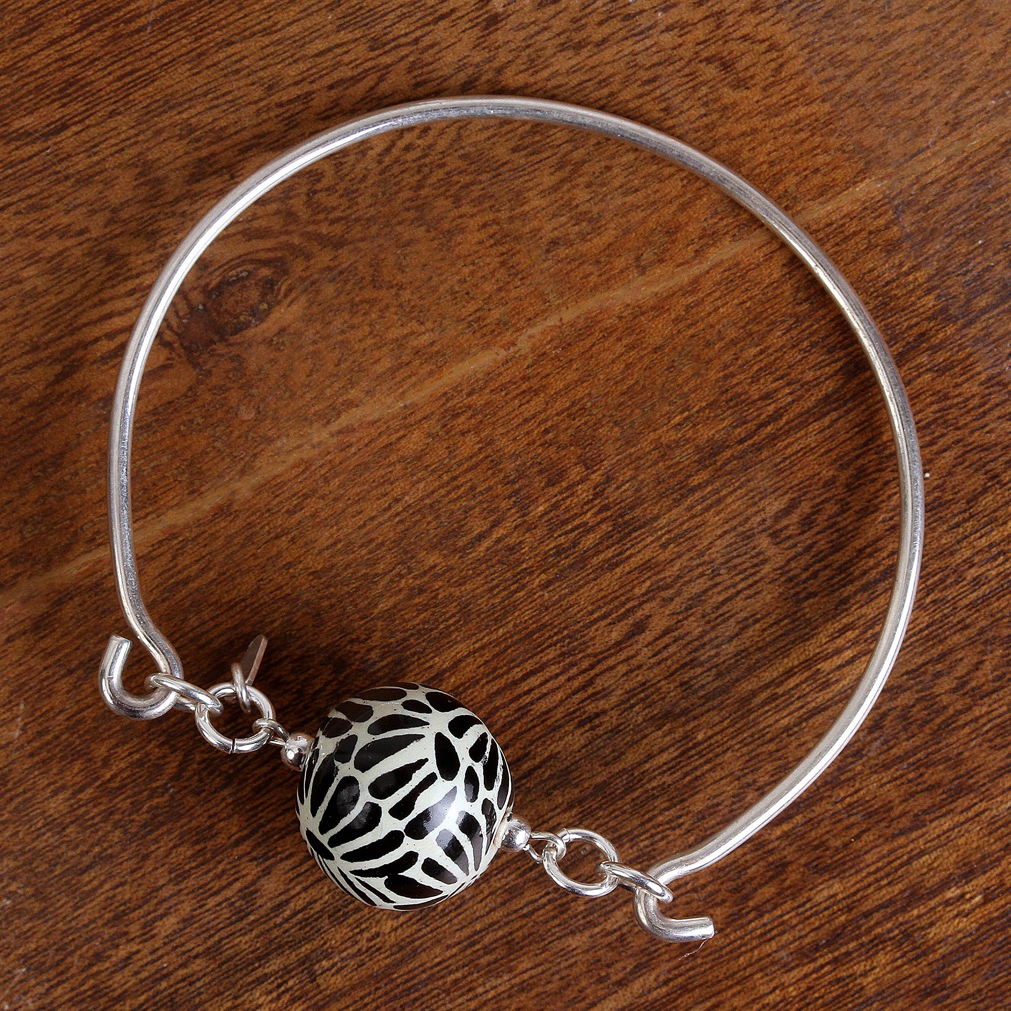 Ceramic piece bracelet with silver charms