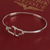 Sterling silver bangle bracelet, 'Heart Harmony' - Sterling Silver Heart Bangle Bracelet from Mexico