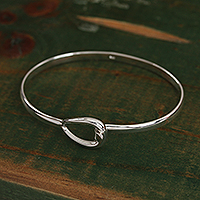 Sterling silver bangle bracelet, 'Gleaming Tear' - Artisan Made Sterling Silver Bangle Bracelet from Mexico