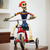 Recycled papier mache sculpture, 'Tricycle Skeleton' - Recycled Papier Mache Sculpture of a Skeleton on a Tricycle thumbail