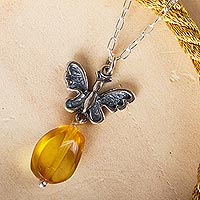 Amethyst pendant necklace, 'Ancient Monarch' - Butterfly-Themed Amber Pendant Necklace from Mexico