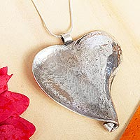Sterling silver pendant necklace, 'Conch Heart' - Combination-Finish Sterling Silver Heart Necklace