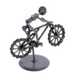 Recycled metal auto part sculpture, 'Boy on a Bike' - Bicycle-Themed Recycled Metal Auto Part Sculpture