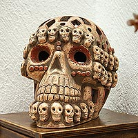 Ceramic sculpture, 'Skull Celebration' (12.5 in) - Handcrafted Ceramic Skull Sculpture with Mini Skull Motif