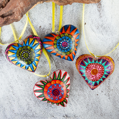 Wood ornaments, 'Zapotec Star Heart' (set of 4) - 4 Zapotec Hand Painted Colorful Wood Heart Ornaments