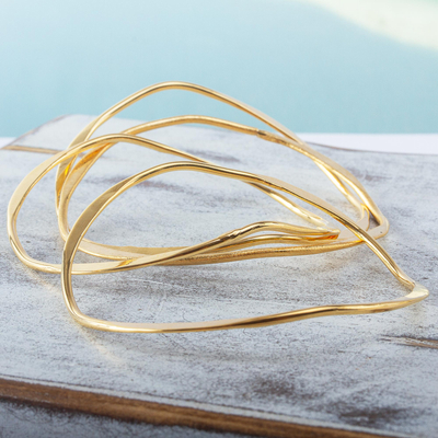 Gold plated stacking bangle bracelets, 'Gold Ribbon' (set of 7) - Gold Plated Stacking Bangle Bracelet Set (Set of 7)