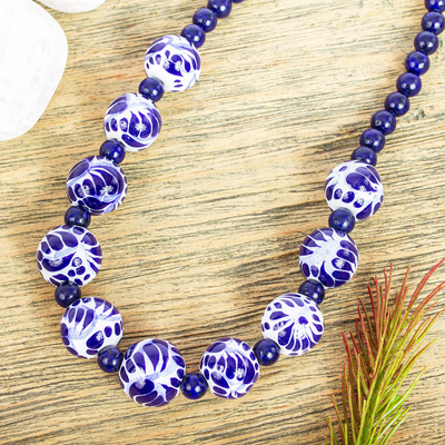 Lapis lazuli and ceramic pendant necklace, 'Cobalt Delight' - Hand Painted Ceramic and Lapis Lazuli Necklace