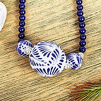 Lapis lazuli and ceramic pendant necklace, 'Indigo Garden' - Ceramic Pendant Necklace with Lapis Lazuli