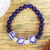 Lapis lazuli and ceramic stretch bracelet, 'Indigo Garden' - Lapis Lazuli Bracelet with Ceramic Pendant