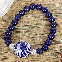Ceramic and lapis lazuli pendant stretch bracelet, 'Cobalt Flourish' - Lapis Lazuli and Ceramic Bead Pendant Bracelet