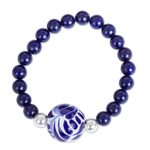 Ceramic and lapis lazuli pendant stretch bracelet, 'Cobalt Flourish' - Lapis Lazuli and Ceramic Bead Pendant Bracelet