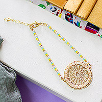 Gold-accented crochet pendant bracelet, 'Aine' - Beaded Pendant Bracelet from Mexico