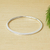 Sterling silver bangle bracelet, 'Polished Ellipse' - Contemporary Sterling Silver Ellipse Bangle from Taxco