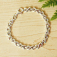 Sterling silver link bracelet, 'Silver Kiss' - Sterling Silver X and O Chain Link Bracelet from Mexico
