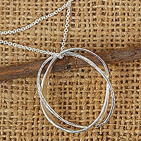 Sterling silver pendant necklace, 'Dancing Orbits' - Sterling Silver Necklace with Pendant Intersecting Circles