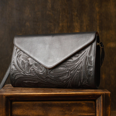 Leather sling, 'Floral Ebony Tote' - Ebony Black Leather Sling Bag with Embossed Floral Pattern