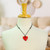 Papier mache pendant necklace, 'Monarchs on Red' - Hand Painted Heart Shaped Monarch Pendant Necklace