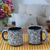 Ceramic mugs, 'Spring Shadows' (pair) - Pair of Floral Talavera Ceramic Mugs in Black from Mexico thumbail
