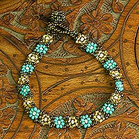Glass beaded bracelet, 'Turquoise Sparks' - Handcrafted Glass Beaded Bracelet with Floral Motifs