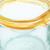 Handblown tumbler glasses, 'High Sunshine Ribbon' (pair) - Pair of Handblown Recycled Tumbler Glasses with Yellow Tones (image 2d) thumbail