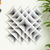 Arte de pared tejido a mano - Arte de pared gris tejido a mano de madera de pino con motivos geométricos